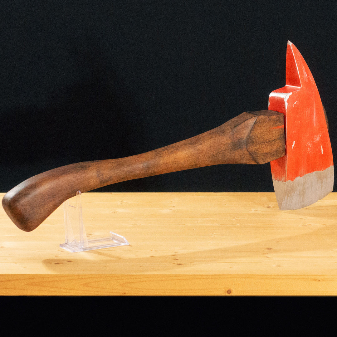 A TF2 Pyro Fire Axe cosplay prop with a Metal paint job