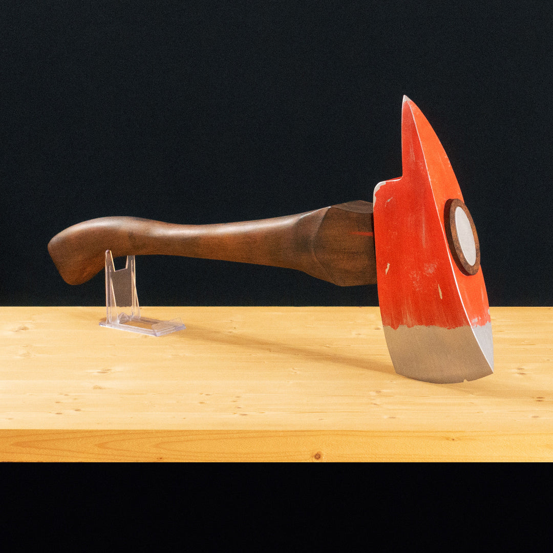 A TF2 Pyro Fire Axe cosplay prop with a Metal paint job