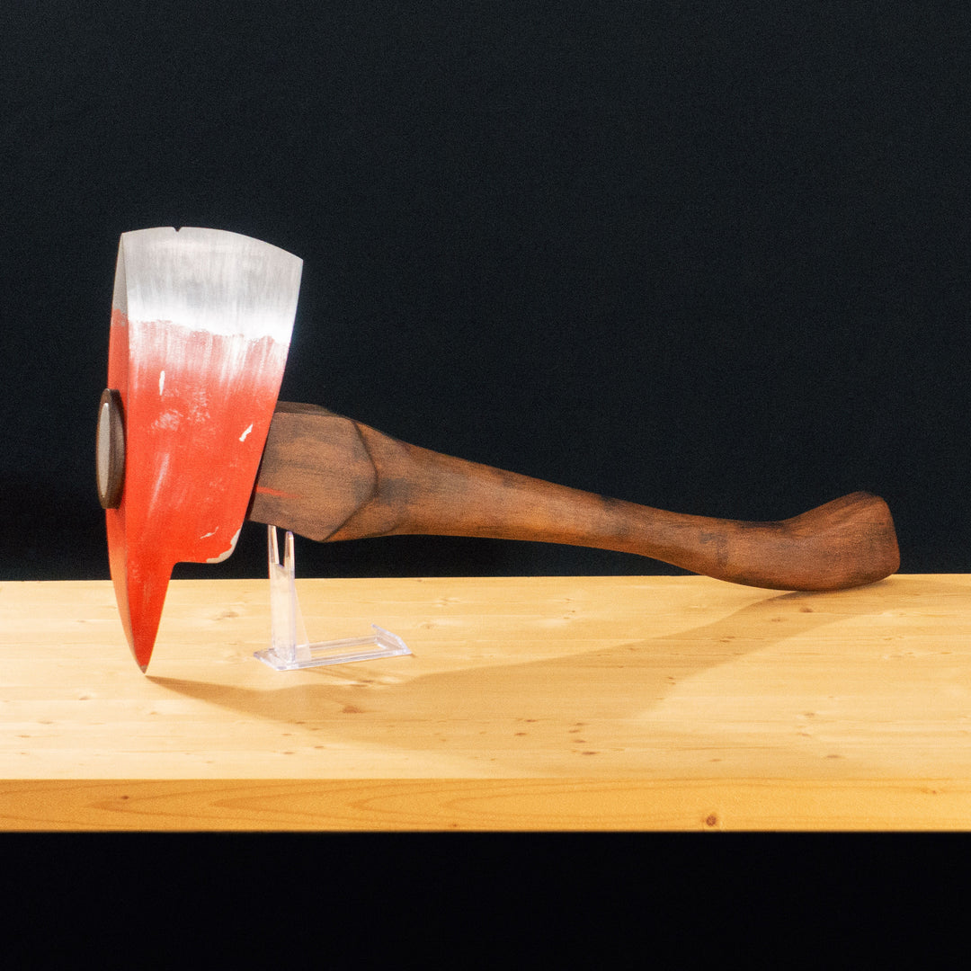 A TF2 Pyro Fire Axe cosplay prop with a Metal paint job