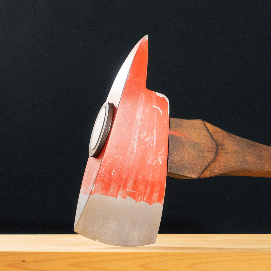 A TF2 Pyro Fire Axe cosplay prop with a Metal paint job