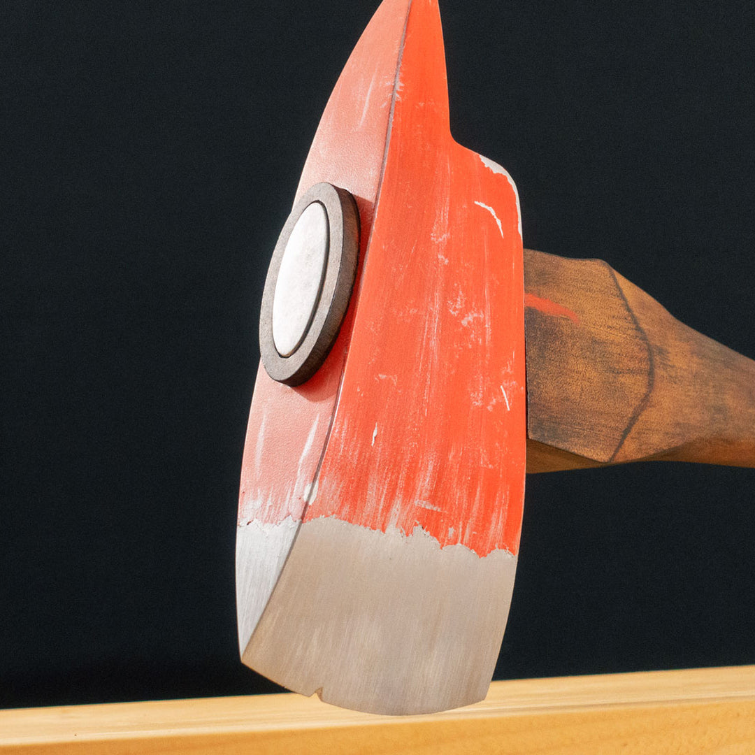 A TF2 Pyro Fire Axe cosplay prop with a Metal paint job