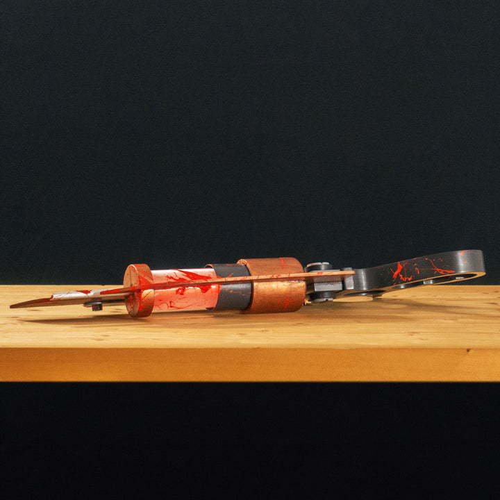 A TF2 Medic Übersaw either bloodied or not! Has a central glowing tube and can be Festivized!