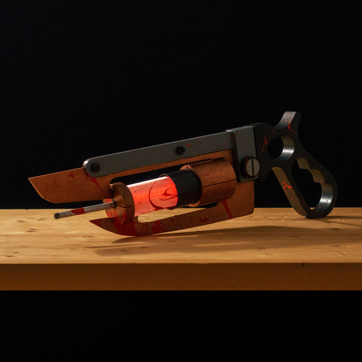 A TF2 Medic Übersaw either bloodied or not! Has a central glowing tube and can be Festivized!