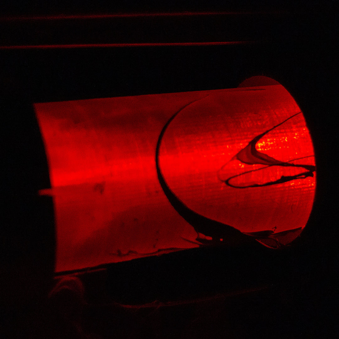 A TF2 Medic Übersaw either bloodied or not! Has a central glowing tube and can be Festivized!