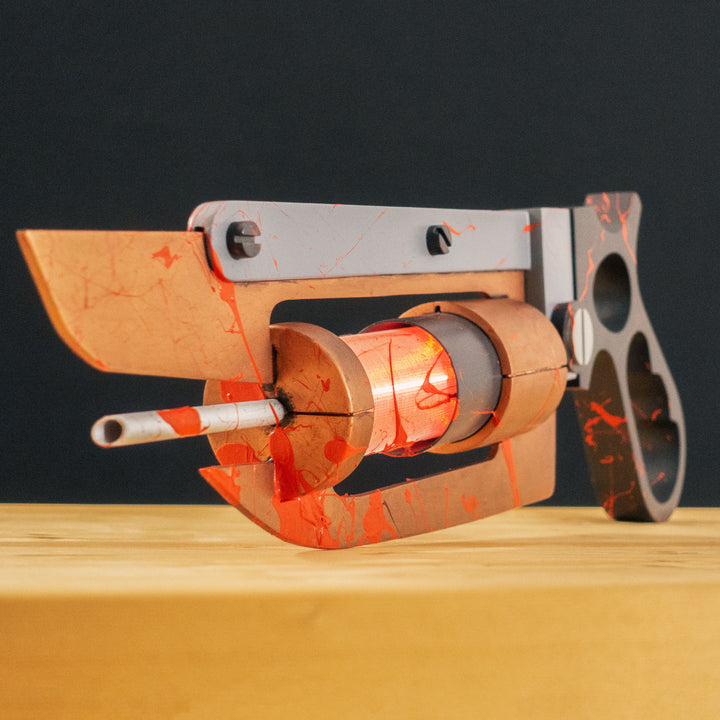 A TF2 Medic Übersaw either bloodied or not! Has a central glowing tube and can be Festivized!