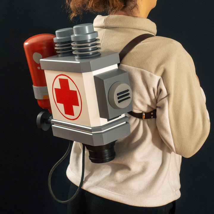 A TF2 Medic Backpack cosplay prop ready to be worn with its leather straps.