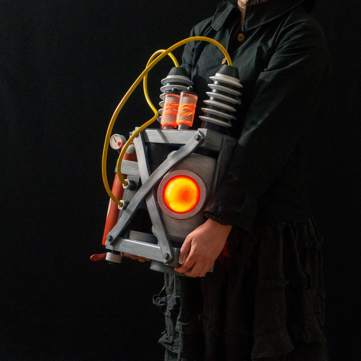 Arkan holding a Team Fortress 2 cosplay prop Quick Fix Backpack from Meet the Real Medic from the red team