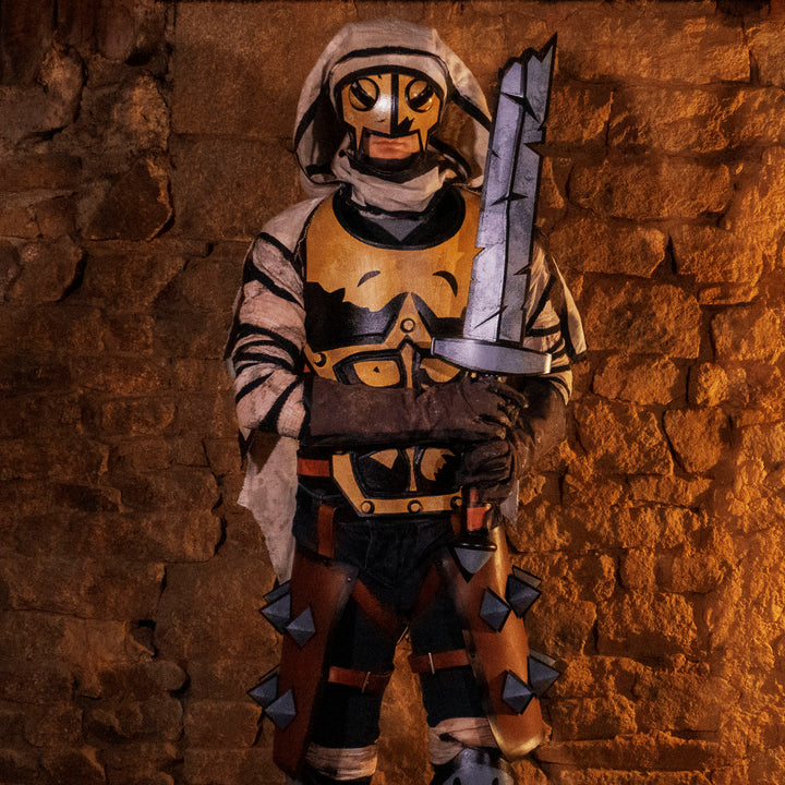 A full Leper cosplay bundle from Darkest Dungeon! Includes the Chest Armour, Wadders, Knee pads, Bandages, Cloak and Sword all with the cell-shadded look!