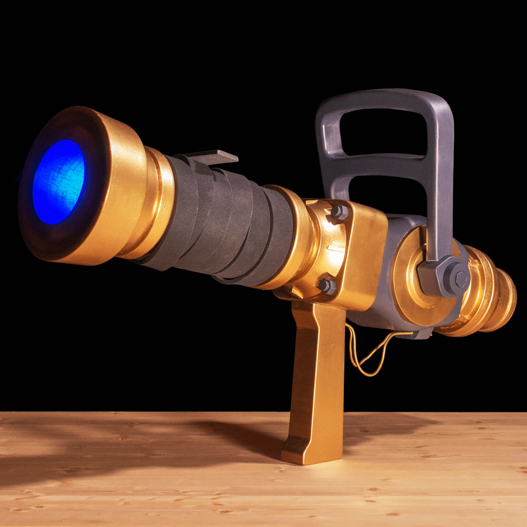 A TF2 Medic Australium Medigun prop for cosplay or collection with a glowing barrel!