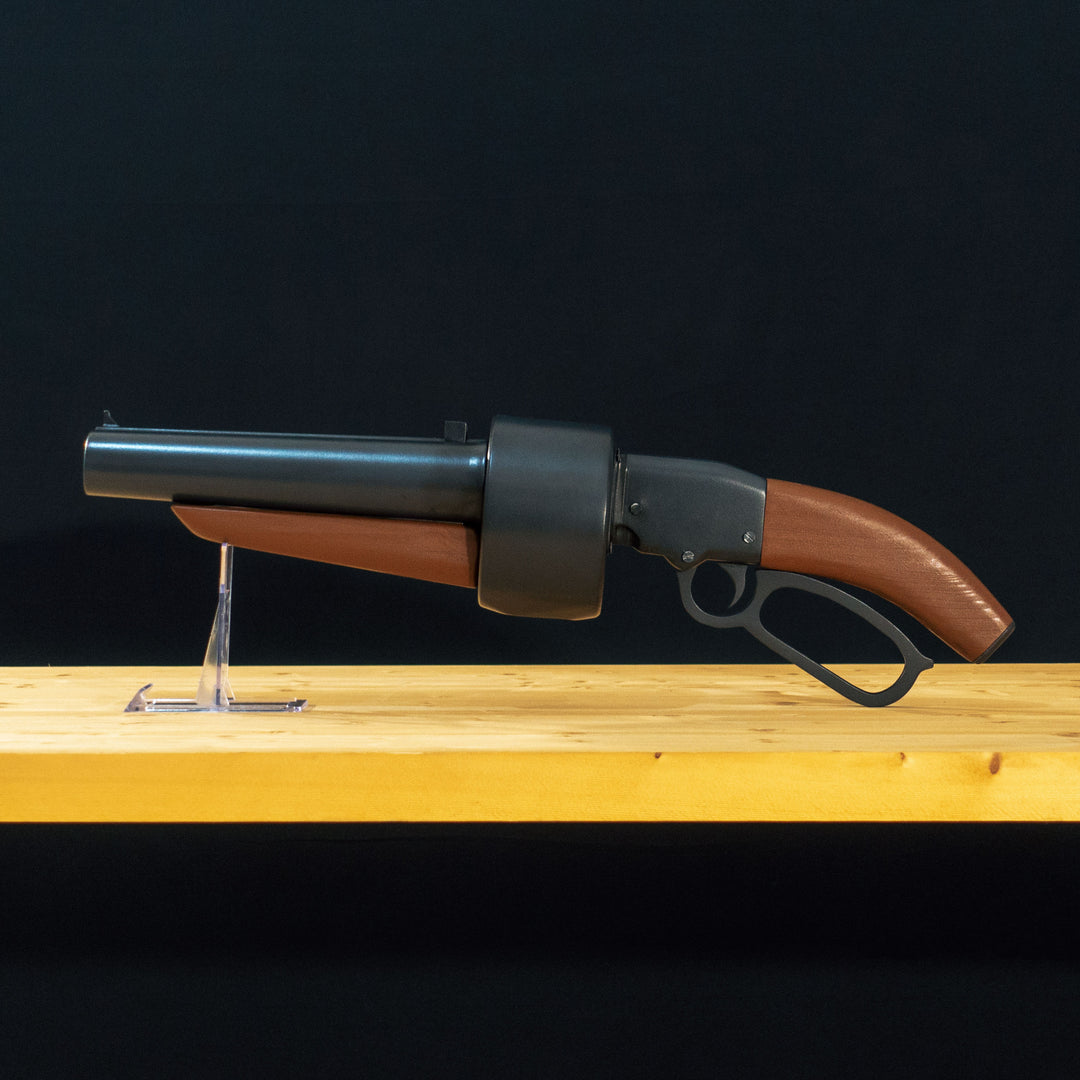 A TF2 Scout Scattergun cosplay prop with its Team Fortress 2 paint job with a moving lever and wooden handles. Comes in Festive too!