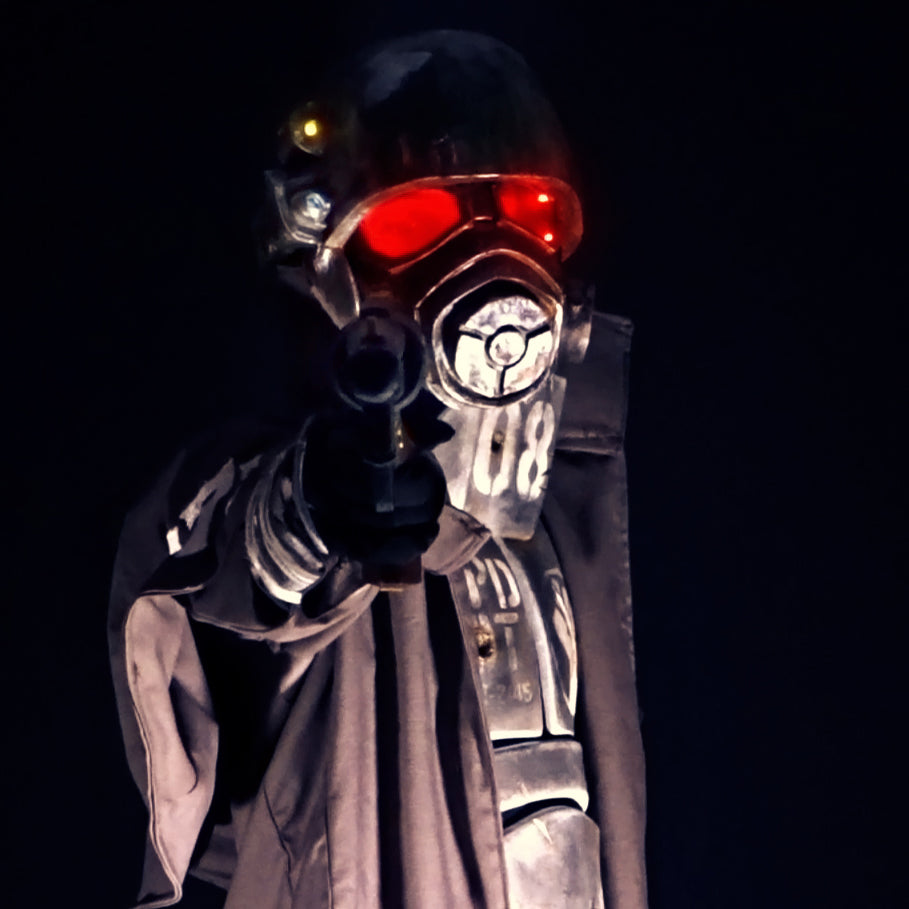 A Fallout New Vegas inspired full NCR Ranger cosplay featuring its main recognisable features: the Embroidered Duster Coat, the Chest Armour, Helmet with glowing lenses, Forearm plates, Gloves with another small steel cutout AND the Air tanks backpack being optional. All armour pieces but the helmet are done with High Density EVA Foam. 