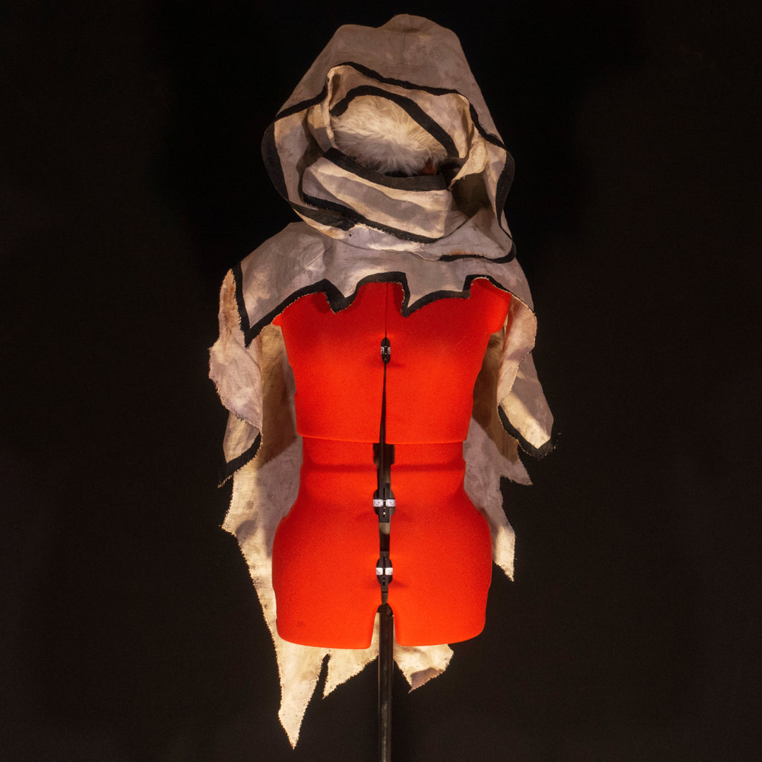 A Leper Cloak from Darkest Dungeon made demi-natte cotton canvas. Comes with the whole desaturated and cell shaded look!