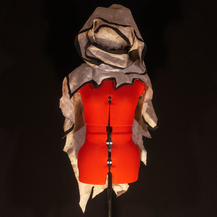 A Leper Cloak from Darkest Dungeon made demi-natte cotton canvas. Comes with the whole desaturated and cell shaded look!