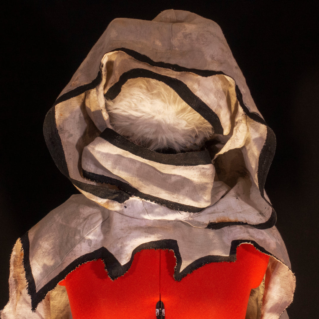 A Leper Cloak from Darkest Dungeon made demi-natte cotton canvas. Comes with the whole desaturated and cell shaded look!