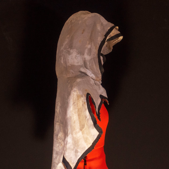 A Leper Cloak from Darkest Dungeon made demi-natte cotton canvas. Comes with the whole desaturated and cell shaded look!