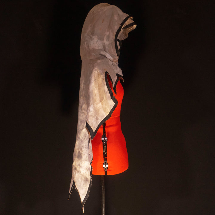 A Leper Cloak from Darkest Dungeon made demi-natte cotton canvas. Comes with the whole desaturated and cell shaded look!