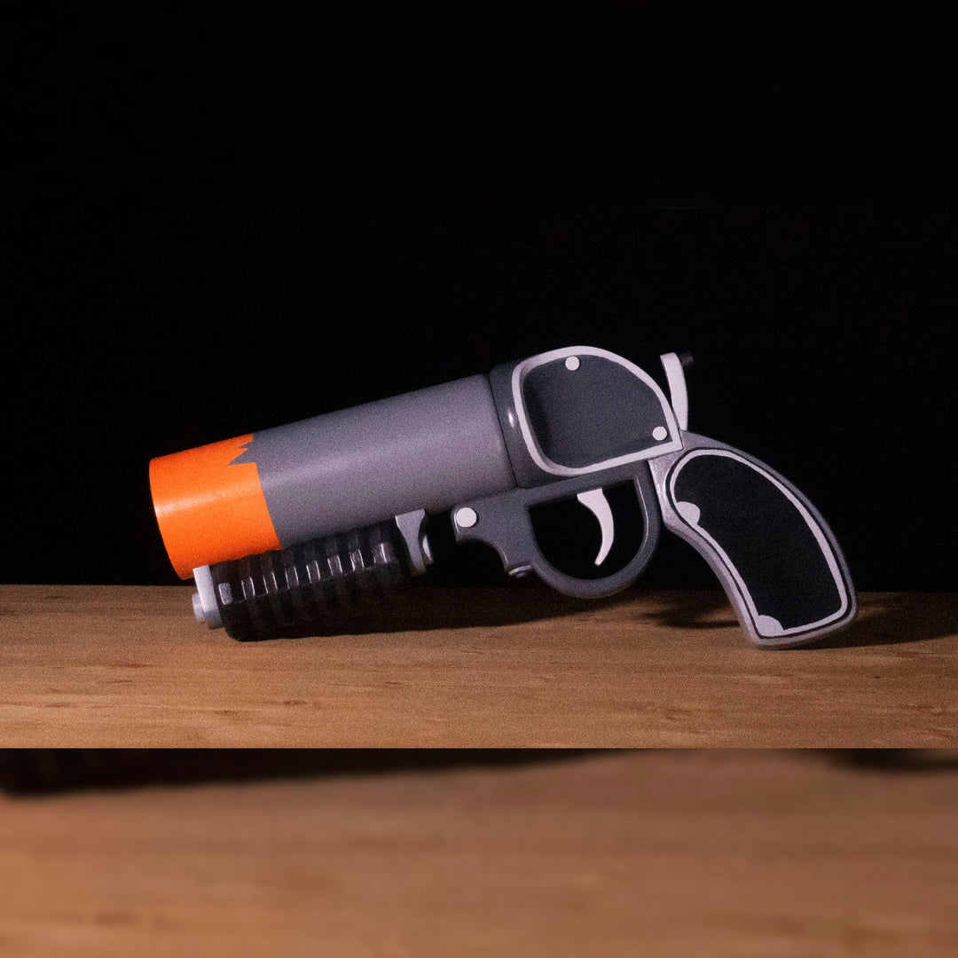 A TF2 Pyro Scorch Shot cosplay prop with its Team Fortress 2 paint job!