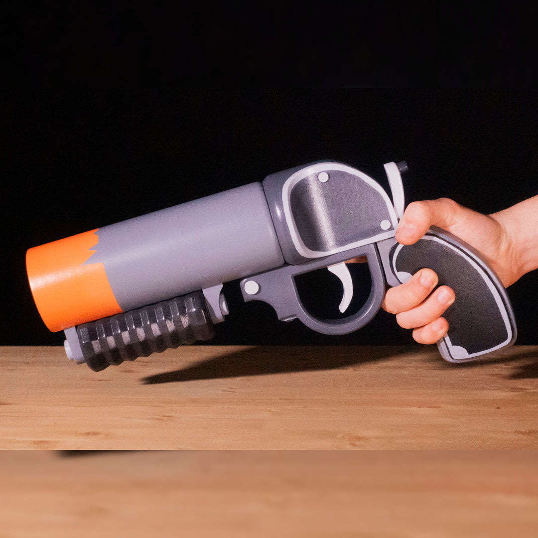 A TF2 Pyro Scorch Shot cosplay prop with its Team Fortress 2 paint job!