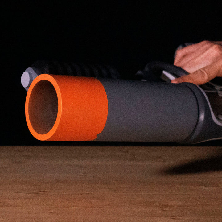 A TF2 Pyro Scorch Shot cosplay prop with its Team Fortress 2 paint job!