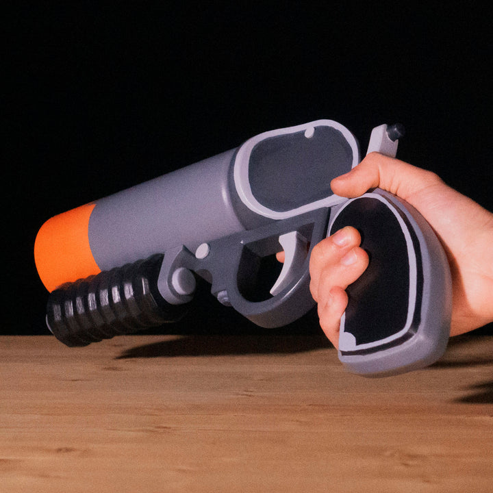 A TF2 Pyro Scorch Shot cosplay prop with its Team Fortress 2 paint job!